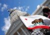 California state flag in front of a white domed capitol building