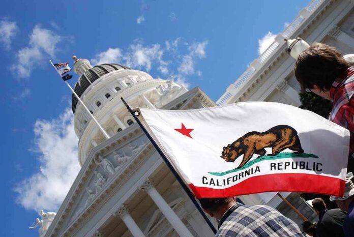 California state flag in front of a white domed capitol building