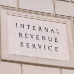 Massive Refund Wave Hits Wallets Internal Revenue Service building sign on a stone wall