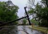 NYC Braces: EMERGENCY Storm Threat Fallen utility poles blocking a wet suburban street