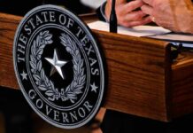 Chaos At Candidate’s Home—No Charges Filed Texas governor seal on wooden podium