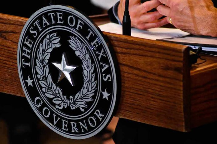 shutterstock_1128379292-1 Texas governor seal on wooden podium
