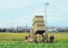 Kuwait Skies ERUPT — What Did Iran Hit? Military defense system deployed in a field with soldiers nearby