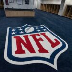 NFL logo on the floor of an empty locker room