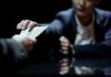 Record Low Poverty, Why So Broke? Hands exchanging cash across a table