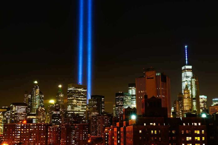 New York City skyline at night with twin blue light beams
