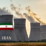 Two-Week Warning: Iran’s Cash Lifeline Vanishes nuclear power plant cooling towers in Iran at sunset