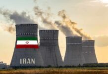Two-Week Warning: Iran’s Cash Lifeline Vanishes nuclear power plant cooling towers in Iran at sunset