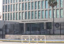 Middle East Warning: Flights Could Vanish Embassy building behind tall black security fence