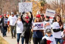 Trump Signal Topples Texas Powerhouse Group of protesters marching with political signs and hats