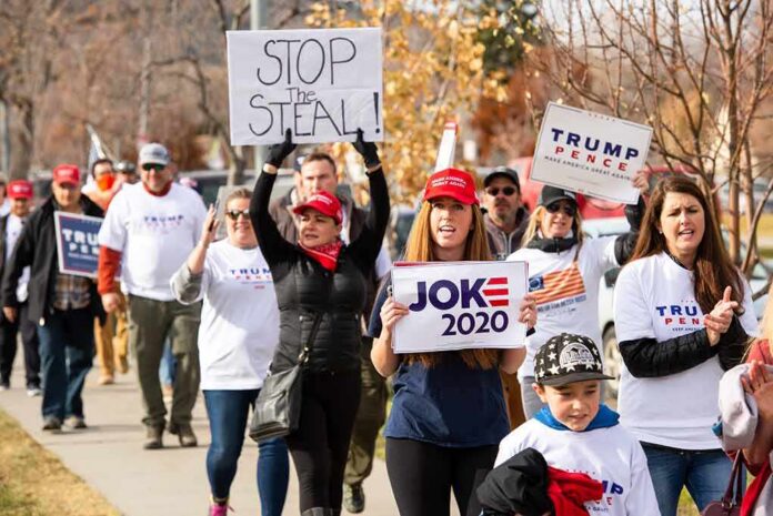 shutterstock_1849449793 Group of protesters marching with political signs and hats