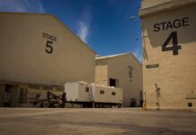 Film studio stages with numbered buildings and trailer