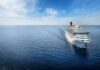 Cruise ship sailing on calm blue ocean