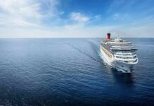 Three Days, Four Kids, Mom In Bahamas Cruise ship sailing on calm blue ocean