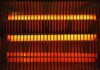 Power Plant Limits Vanish – Grid on Edge Electric space heater with glowing heating elements behind a safety grille