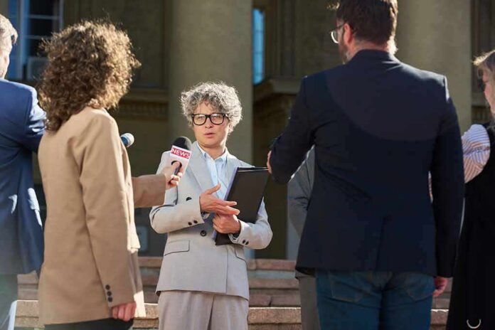 Spokesperson addresses reporters on courthouse steps