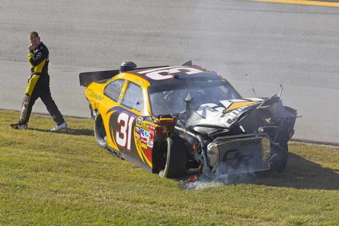 shutterstock_64147261 Race car with heavy front-end damage on grass