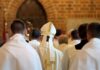 Pope Confronts 1792 Killing Ground Bishop in white mitre among clergy during church procession