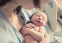 2-Year-Old Euthanized – Controversial newborn baby sleeping in a parent's arms