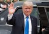 Trump Floods Beef—Ranchers Brace Donald Trump waves while standing beside a black vehicle
