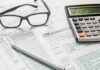 Meta’s Bold Bet: Free Eyes For Vets Tax forms with calculator, glasses, and pen