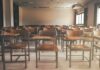 Education Chief Tries To Fire Herself Empty classroom with rows of wooden desks and chairs