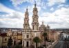 Church Funeral Turns Bloodbath historic cathedral with twin towers in a colonial cityscape