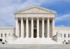 Bond Hearings Axed? Justices Weigh Bombshell Front view of the Supreme Court building with large columns and steps under a blue sky
