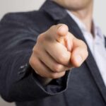 Trump Signals Firing – What Triggered It? hand pointing directly at the camera