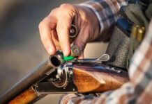 Locked Or Loaded? Mother Under Fire Hand loading shells into a break-action shotgun