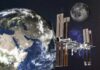 International Space Station orbiting Earth with the Moon in the background