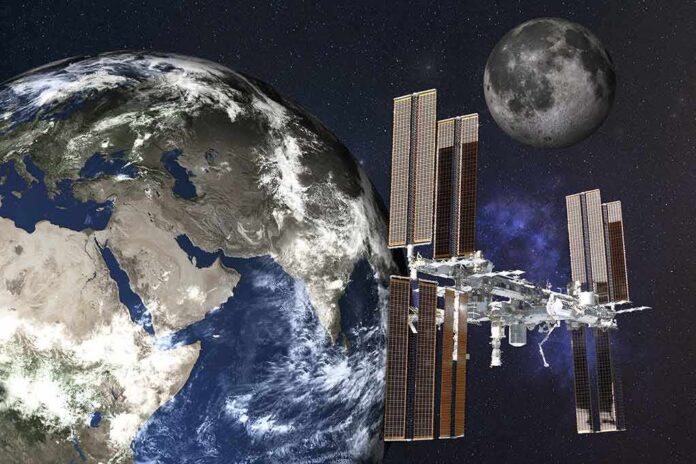 shutterstock_1674331843-1 International Space Station orbiting Earth with the Moon in the background