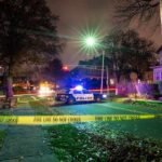 Campaign Sign Run Turns Nightmare Police car blocks residential street at night behind caution tape