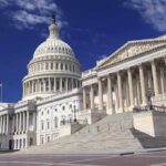 Daylight Brawl: Trump Targets Cotton The U.S. Capitol building with its dome and columns under a blue sky