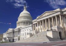 Daylight Brawl: Trump Targets Cotton The U.S. Capitol building with its dome and columns under a blue sky
