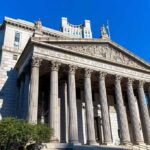 Germany’s Child-Marriage Stuns neoclassical courthouse with tall columns and pediment sculptures