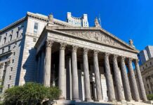 Germany’s Child-Marriage Stuns neoclassical courthouse with tall columns and pediment sculptures