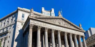 neoclassical courthouse with tall columns and pediment sculptures