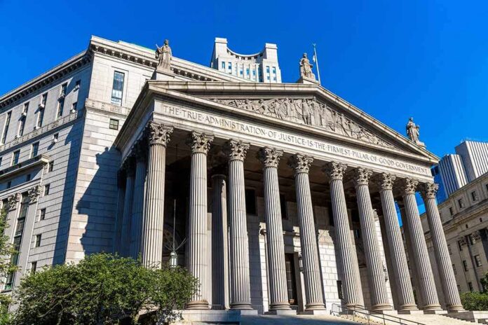 shutterstock_2143249453 neoclassical courthouse with tall columns and pediment sculptures