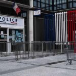 Principal Down – Staffer Stops 14 Year Old Shooter Police station entrance with barriers and French flag colors