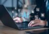 AI Windfall: Bezos Dangles Three-Day Weeks Hands typing on laptop with AI and tech icons overlay
