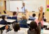Oregon Horror: Did Mom Buy The Gun? Teacher at front of classroom as students raise hands