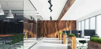 Modern open-plan office with wood accents and glass meeting room